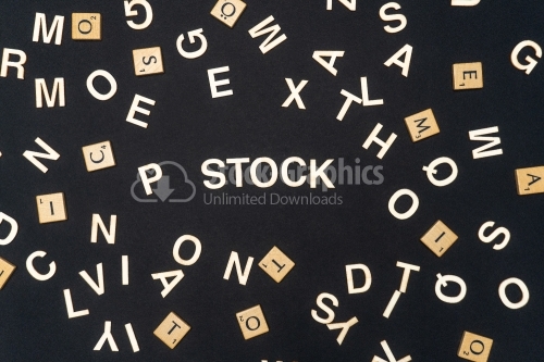 STOCK word written on dark paper background. STOCK text for your concepts
