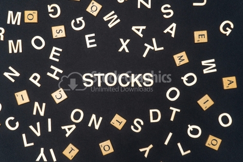 STOCKS word written on dark paper background. STOCKS text for your concepts