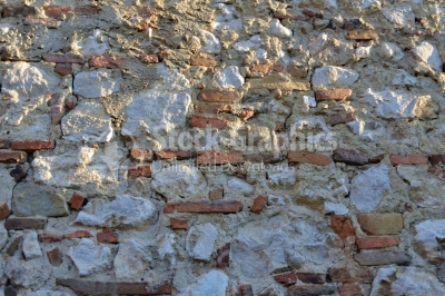 Stone wall built with bricks in it
