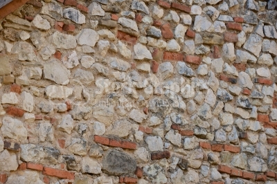 Stone wall built with bricks in it