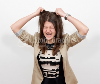 Stressed businesswoman ruffles her hair