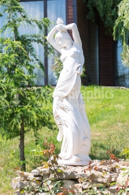 Sun-lighted statue of a woman