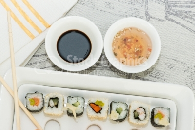 Sushi plate with sauces top view