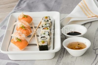 Sushi with soy sauce and sweet and sour sauce