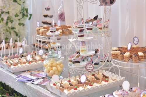 Table full with cakes and sweets at a wedding reception