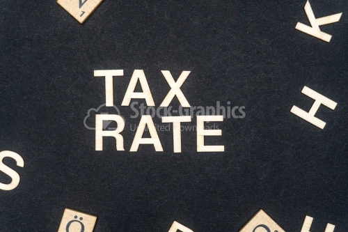 TAX RATE word written on dark paper background. TAX RATEtext for your concepts