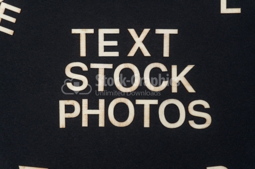 TEXT STOCK PHOTOS word written on dark paper background. TEXT STOCK PHOTOS text for your concepts