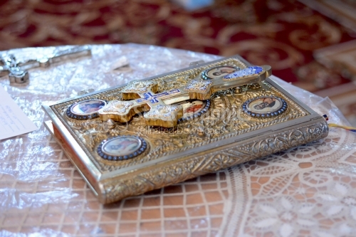 The holy gospel and the holy cross on a table in the Orthodox church