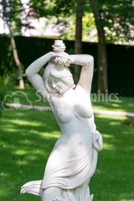 The statue of a woman in the yard