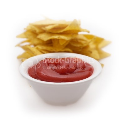 Tomato ketchup with chips behind