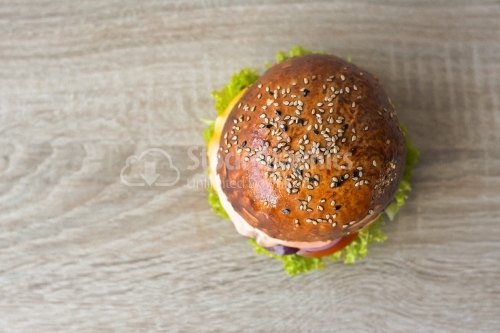 Top view BBQ burger wooden background