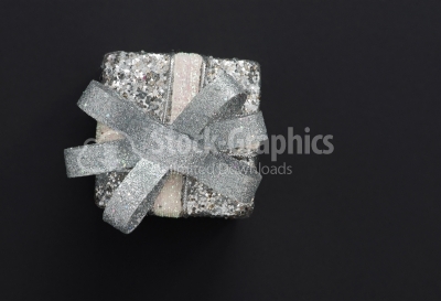 Top view of christmas gift box in silver wrapping paper