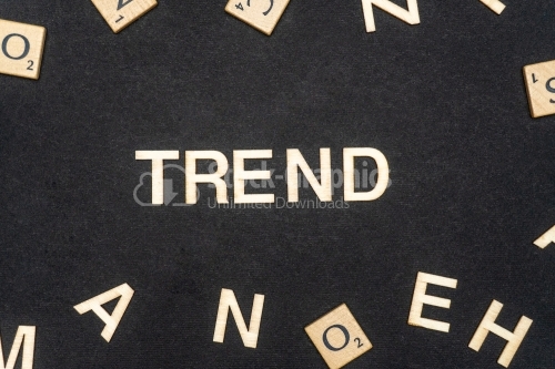 TREND word written on dark paper background. TREND text for your concepts