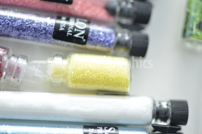 Tubes with nail glitter for professional nail salons