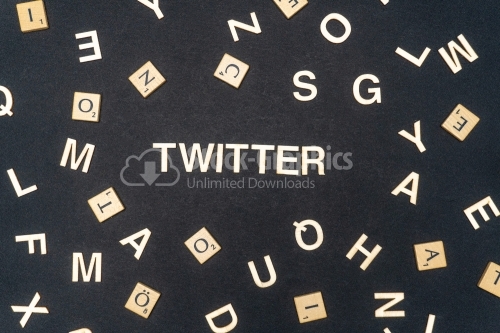 TWITTER word written on dark paper background. TWITTER text for your concepts