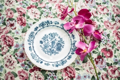 Vintage dinner plate on floral background