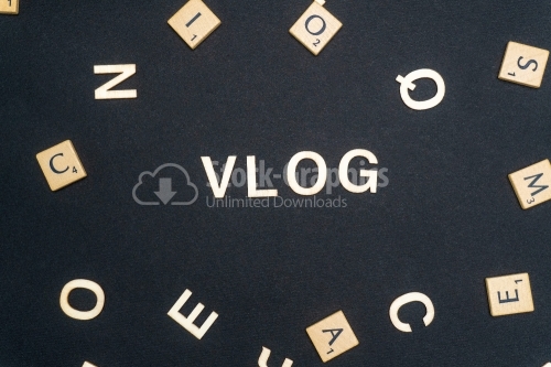 VLOG word written on dark paper background. VLOG text for your concepts