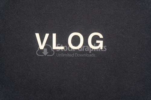 VLOG word written on dark paper background. VLOG text for your concepts