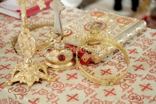 Wedding crowns and bible prepared for ceremony