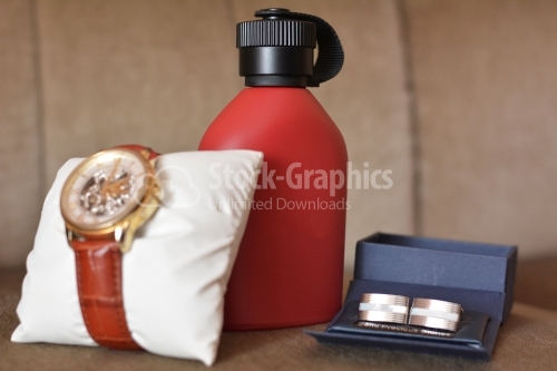 Wedding details. Set of groom accessories on wedding day. Men's watch, perfume and cufflinks.