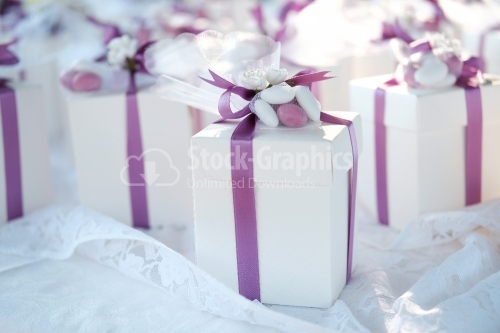 Wedding gift boxes with white and pink ribbons