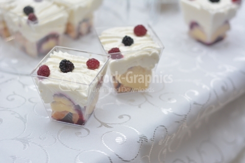White cream and fruits pudding decorated with raspberries and blackberries