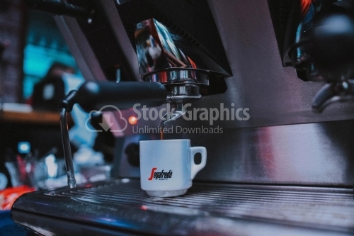 White cup under the coffee dispenser
