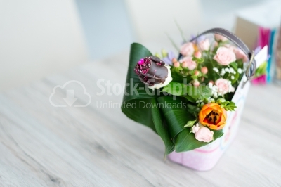 White-wooden table with a bouquet of spring flowers