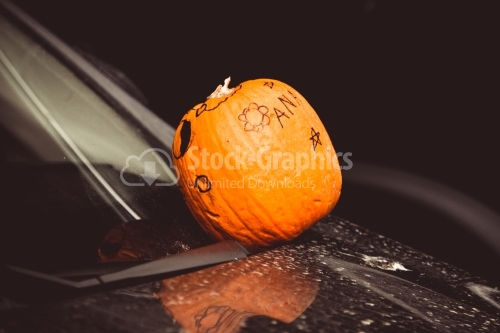 Whole pumpkin on a car