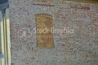 Window on wall filled in with bricks