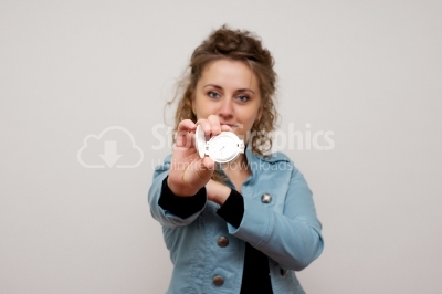 Woman holding  clock 