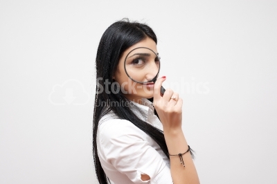 Woman look through magnifying glass and smile