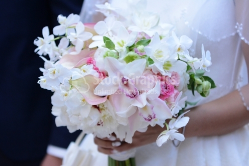 Wonderful bridal bouquet. Lily, roses, orchids.