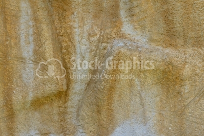 Yellow cement wall with plaster relief