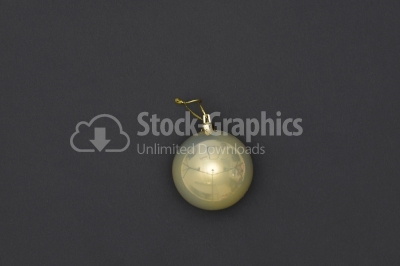 Yellow Christmas Bauble Tied Over Black Background