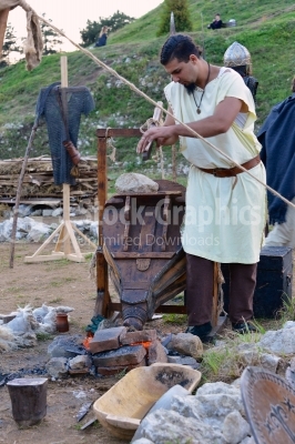 Young Blacksmith working on a ancient festival