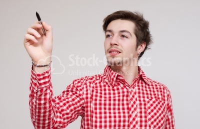 Young businessman holding a pen