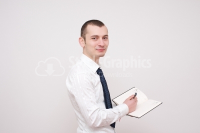 Young businessman with a notebook