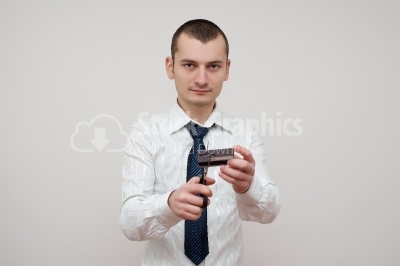Young man cutting a credit card