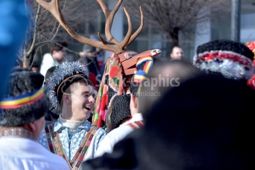Young man dressed in the traditional romanian port. Goat game.The annual Winter Traditions and Customs Festival.