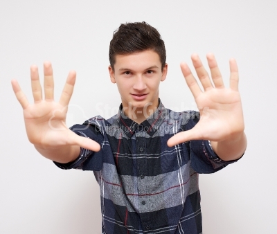 Young man showing 10 fingers