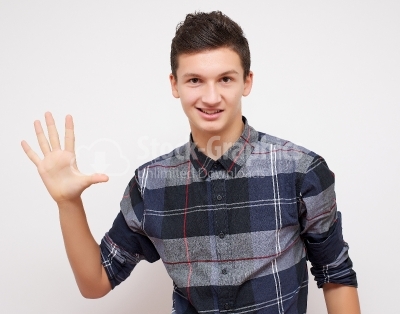 Young man showing 5 fingers