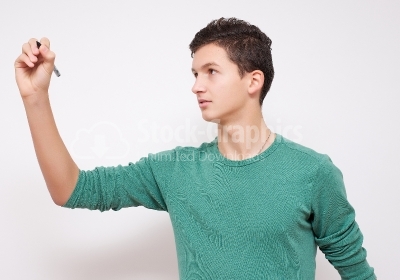 Young man writing on transparent wipe board - Isolated - Stock I