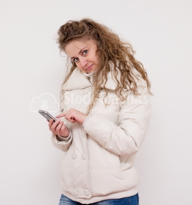 Young woman typing message in smart phone